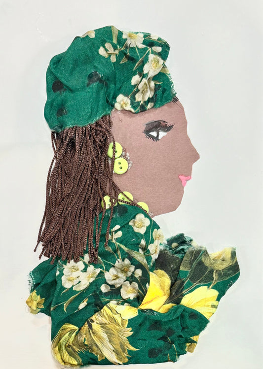 A handmade card of a woman in profile, created using fabric, buttons, and yarn. She wears a green floral headscarf and matching outfit, with yellow buttons for earrings and brown yarn for hair.