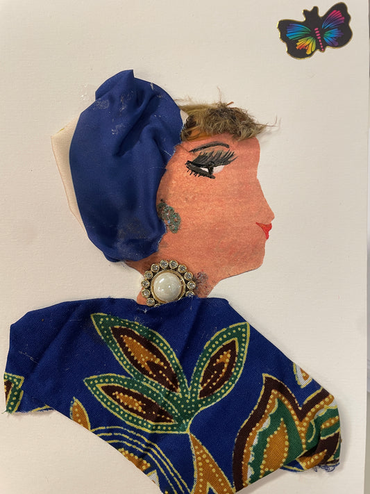 This is a handmade card of a woman named Monique Borough. She wears a blue and cream headwrap and a blue patterned top with green and gold leaf designs. The top right corner has a butterfly sticker.