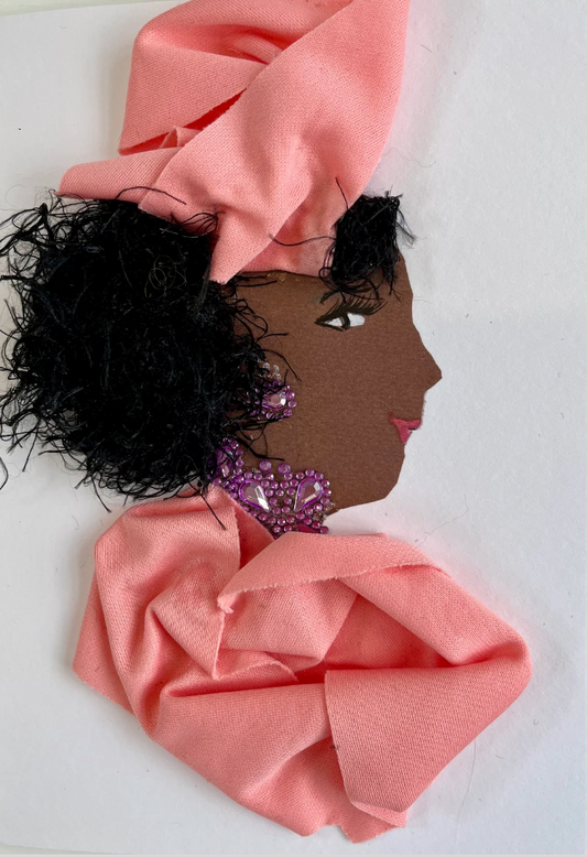 Petunia Paddington is wearing a bubblegum pink outfit with an accent of purple jewellery.