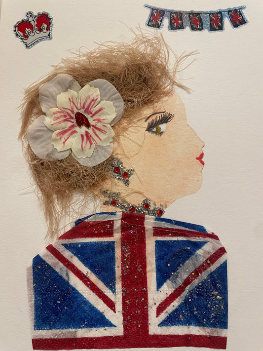 This is a handmade card of a woman named Union Uma. She has a tousled sandy blonde hairstyle with a large cream flower, a sequined Union Jack garment, and red jewelled accessories. A crown and flag stickers are in the background.
