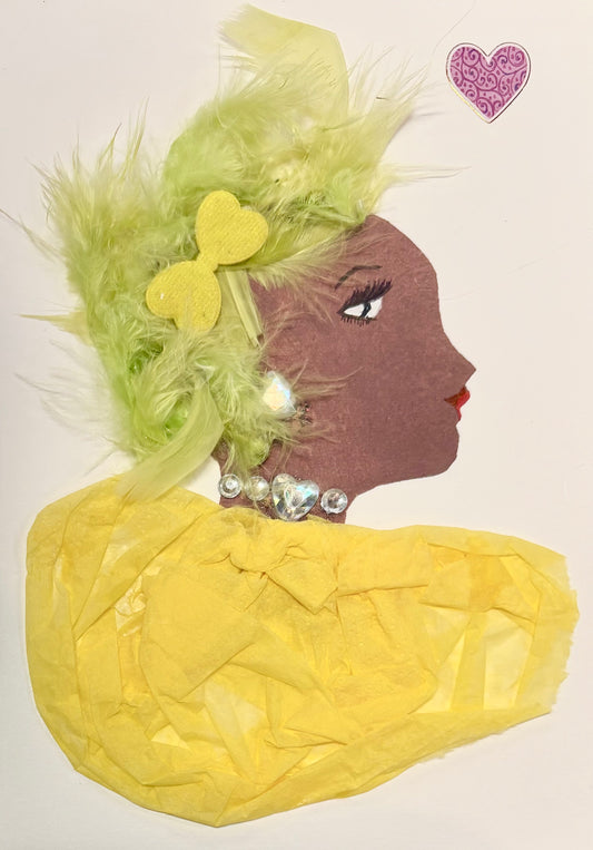 A woman has green hair made of feathers and a yellow bow as an accessory. She wears a yellow blouse. Her jewellery is silver with the necklace and earring matching. There is a pink heart in the upper right corner. 