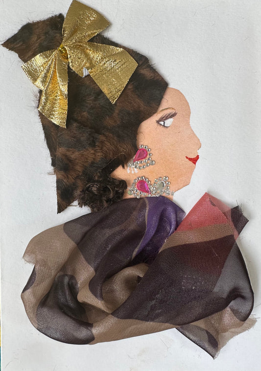 I designed this handmade card of a woman dressed in a multi-brown toned blouse. Her hatinator is a fur-like material, and it is held together by a gold bow. Her outfit is completed with pink and silver jewellery. 