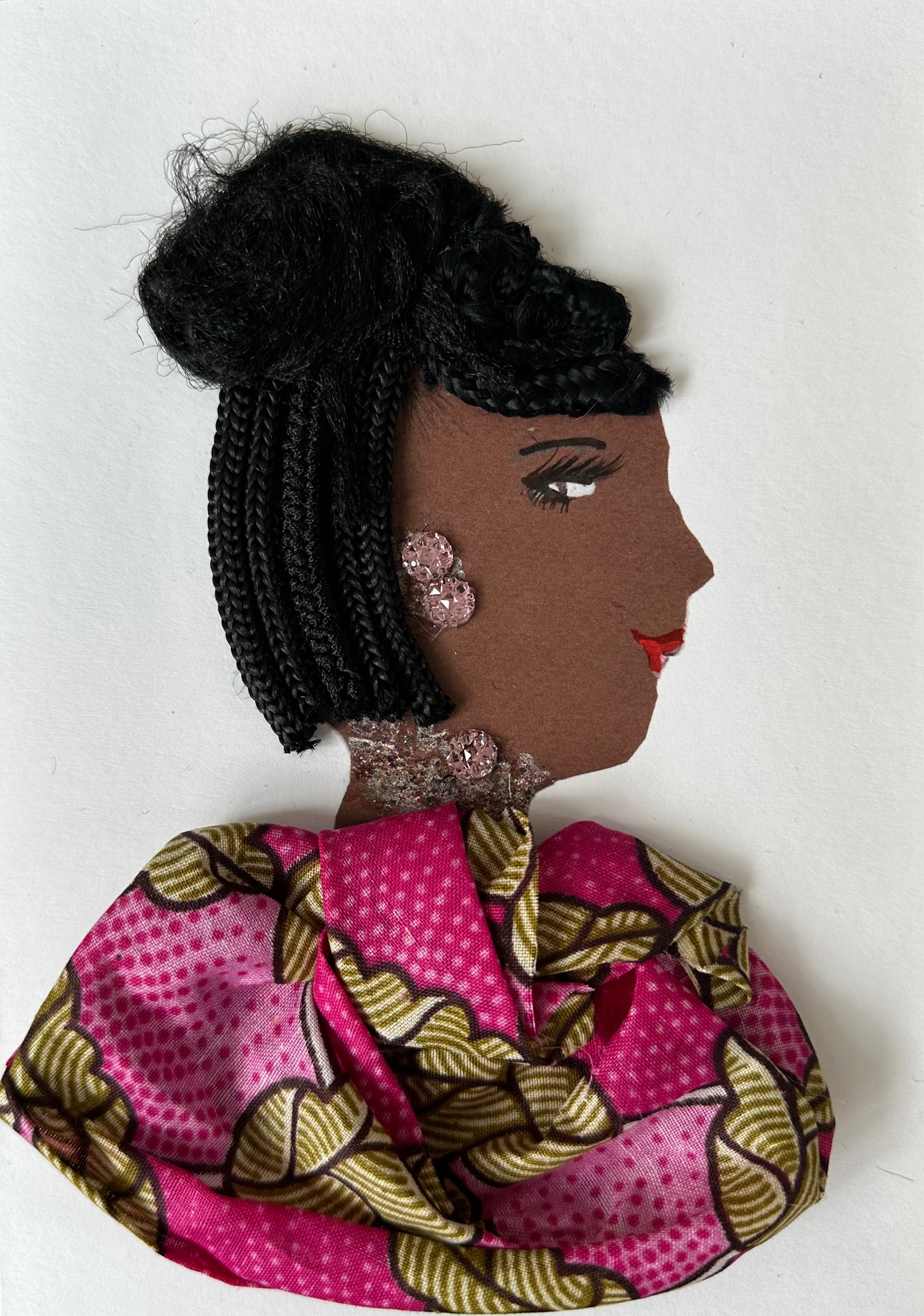 I designed this handmade card of a woman wearing a pink patterned blouse with walnut coloured accents. Her earrings and necklace match with the soft pink colour. 