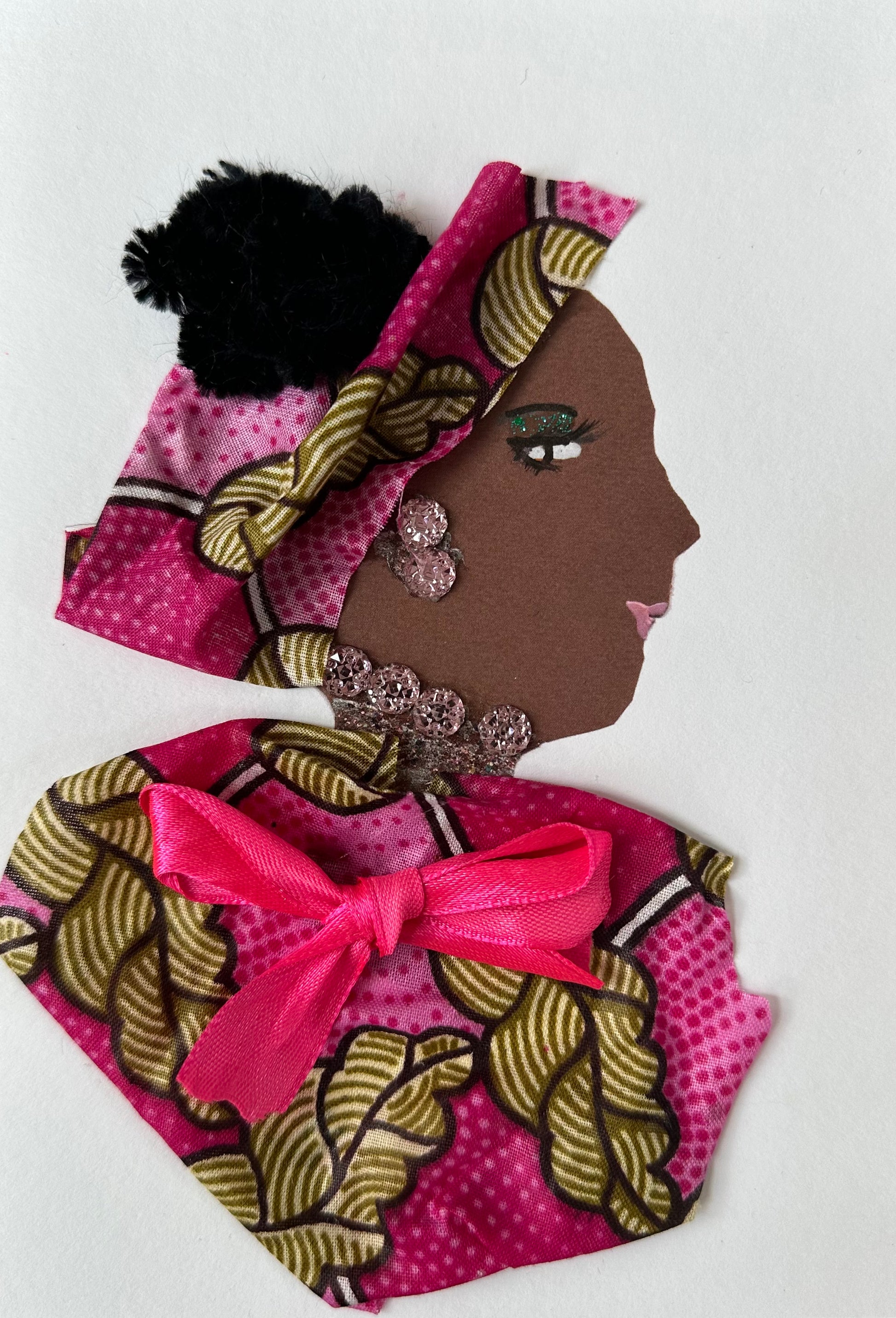 I designed this handmade card of a woman wearing a pink patterned blouse and hatinator with walnut coloured accents. She has a bright pink bow in the center of her blouse. Her earrings and necklace match with the soft pink colour. 