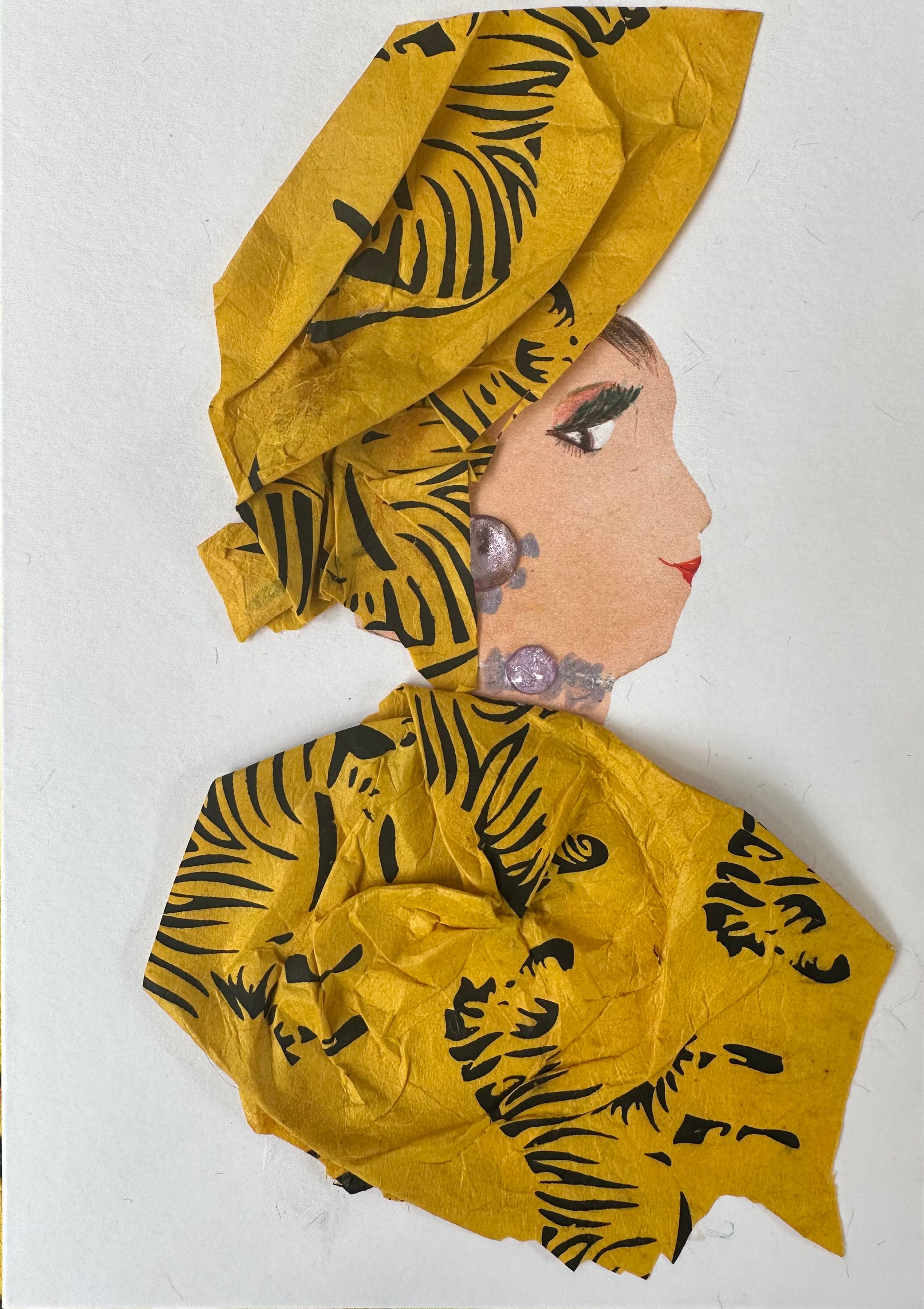 I designed this handmade card of a woman dressed in a matching hatinator and blouse. They are both an amber color with zebras printed on them. It is finalized with jewellery that is a purplish-grey colour. 