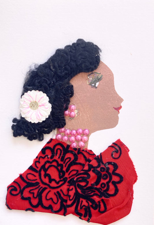 This card displays a woman named Canary. Canary wears a red dress which is embroidered with black flowers. Her necklace and earrings are both a soft pink pearl, and she wears a baby pink flower in her black curly hair.