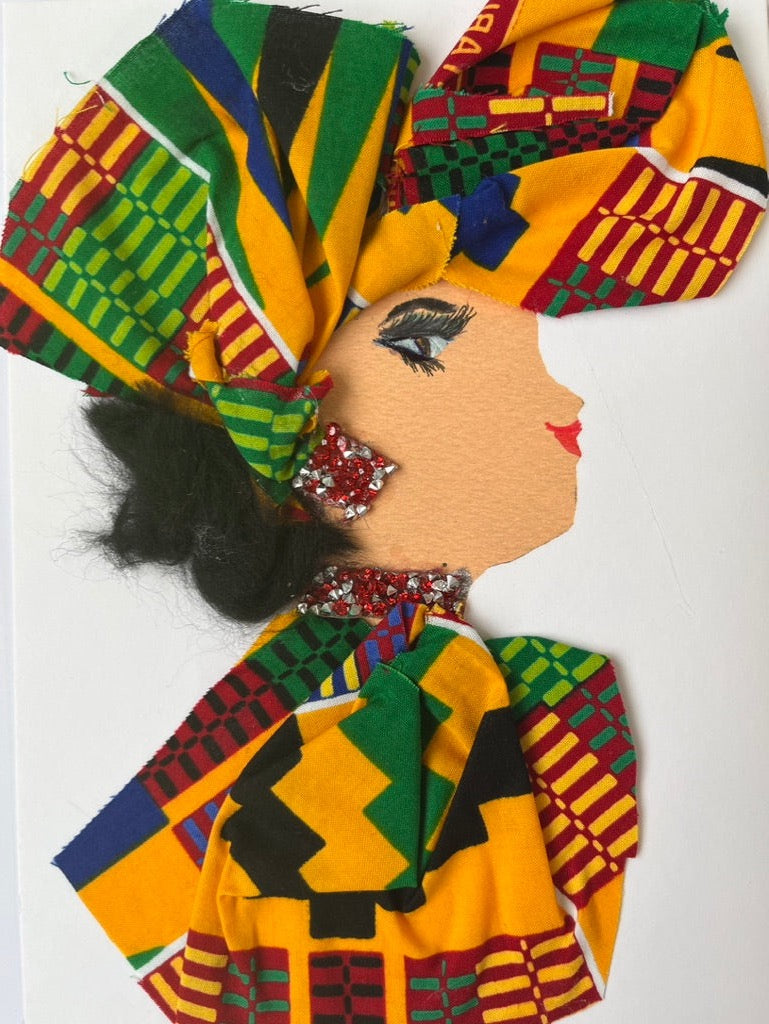 This card is called Miah Manuela. She wears a bright yellow patterned headdress and top, and red and silver jewellery. 