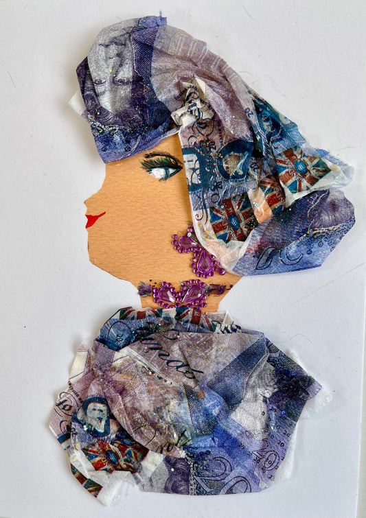 This card is called Camilla Cobalt. She wears a money printed headdress and matching blouse, and purple gem jewellery.