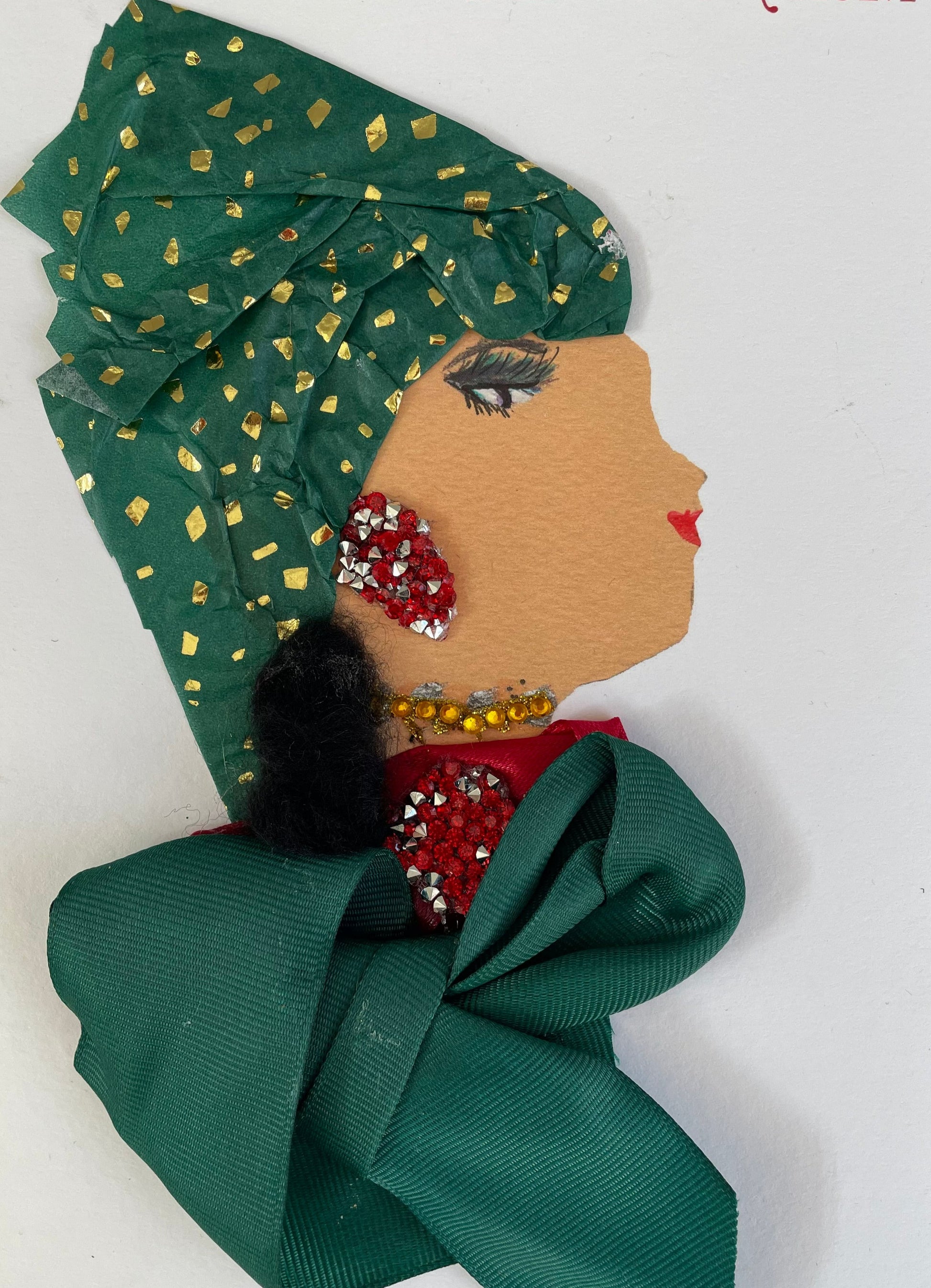 I designed this card of a woman named Ginny Green. She has a white skin tone and is wearing a dark green blouse that resembles a bow. She has a matching set of red and silver diamanté earrings and necklace. She also layered a gold and blue jewel-like necklace. Ginny is wearing a green and gold confetti headpiece. It says "Merry Christmas" in the top left corner.
