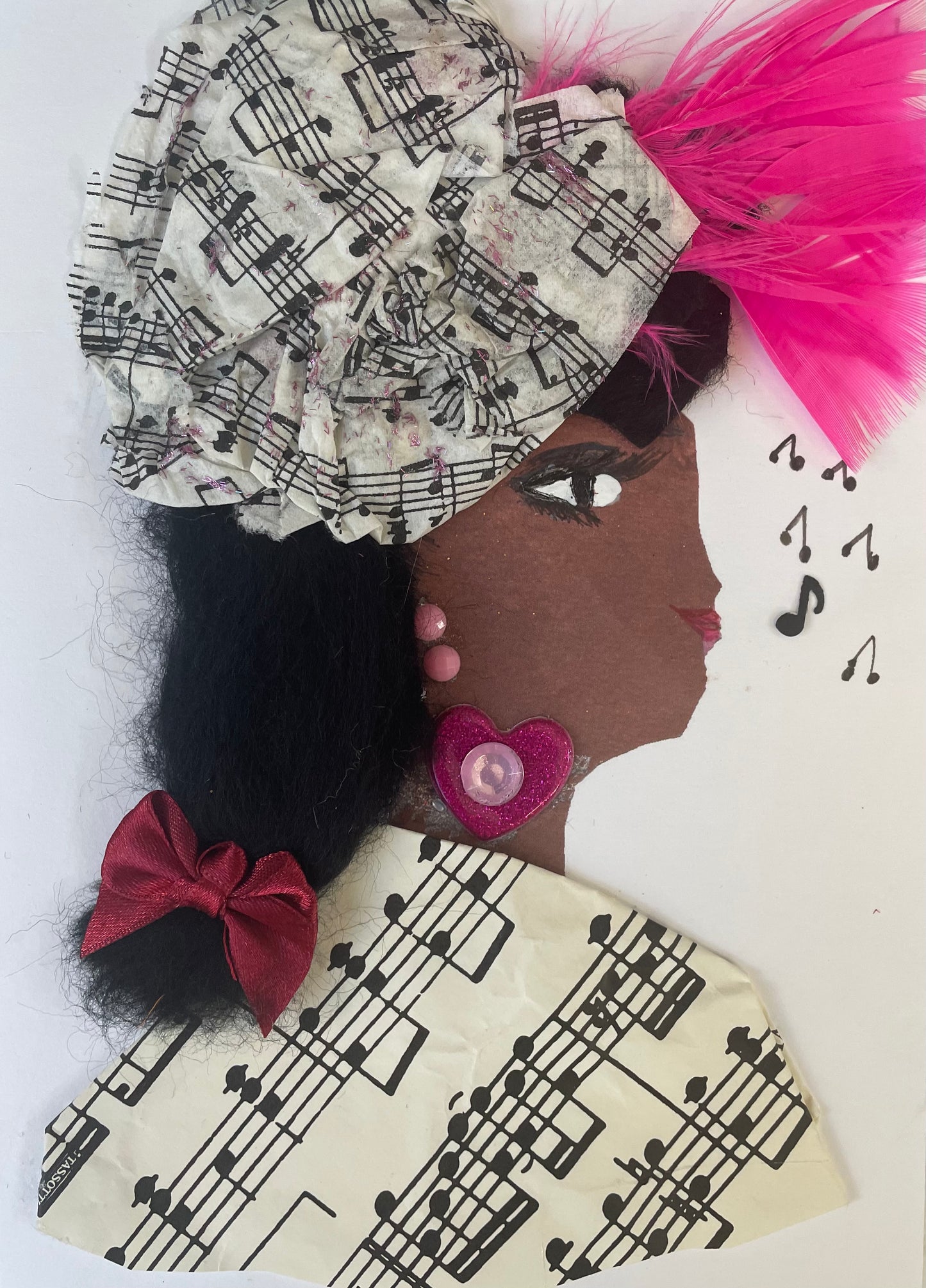 I designed this card of a woman named Manor Musical. She is wearing a musical print hat with vibrant pink feathers coming out the front of it. At the bottom of her hair there is a maroon bow. She wears a music print blouse. She wears a pink heart necklace with pink gem jewellery. To the side of her face there are some music notes. 