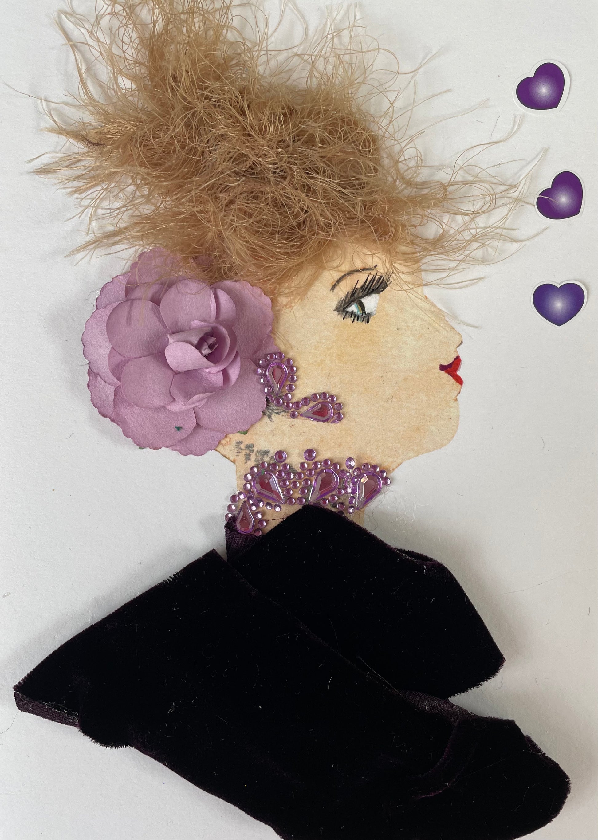 I designed this card of a woman named Doctor Regal Purple. She has a white skin tone and is wearing a dark purple blouse with light purple diamanté earrings and necklace. She added a light purple flower to her hair. There are three dark purple  hearts to the right of her. 