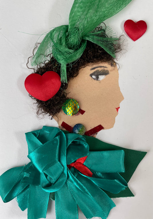 I have made this card called Doctor Emerald Glade. She has a white skin tone and is wearing a dark green blouse with big emerald green ribboned bow. In the blouse, there's a hint of red ribbon. She is wearing a maroon necklace with a shimmery blue and green jewel in the middle. She is wearing a set of turquoise earrings. There is a red heart in her hair as well as a green bow. There is another red heart to the right of her. 