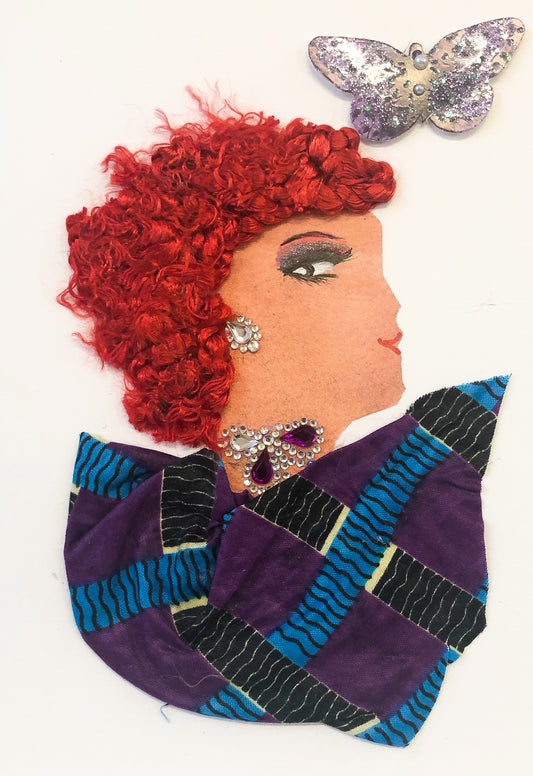 This card shows a woman with bright red hair wearing a purple printed dress. She wears diamond jewellery with amethyst accents, and has a silver butterfly in the background