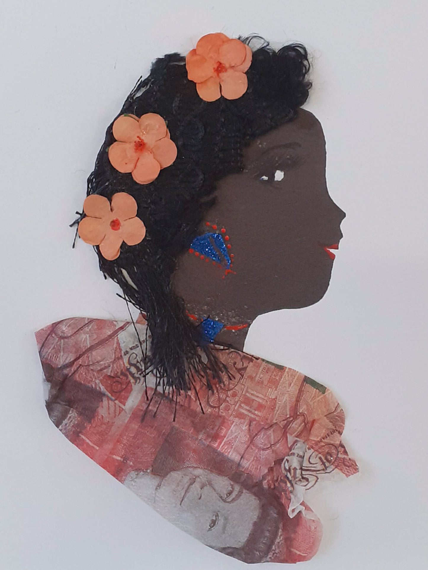I designed this card of a woman named Roxy Bloom. She has a black skin tone and wears three peach coloured flowers in her hair. She wears a money print blouse. She wears blue and red jewellery. 