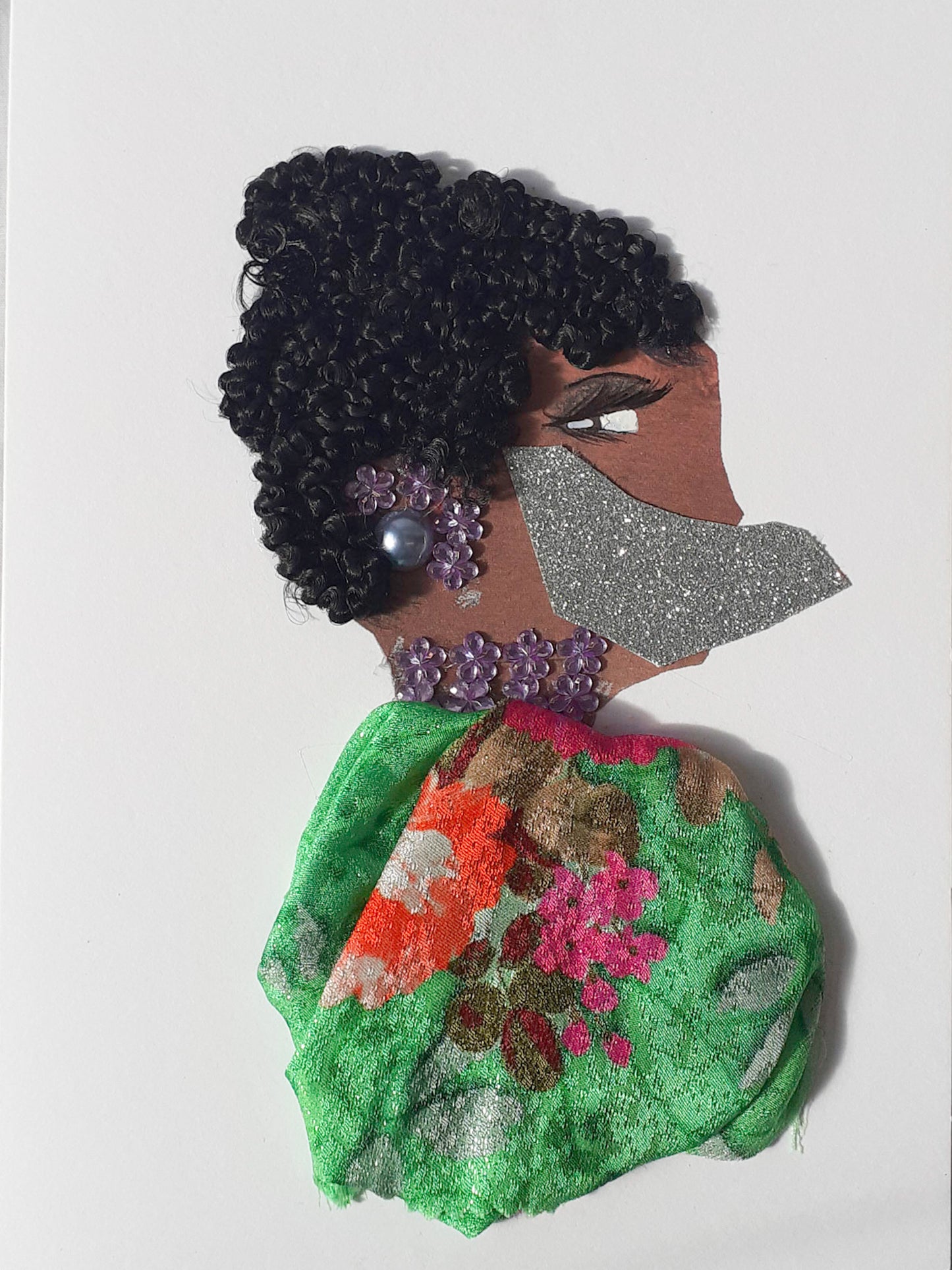 I designed this card of a woman named Maskie. She has a brown skin tone and is wearing a face mask that is green and glittery. Alice has a green flowery dress and matching purple earrings and has her hair is in a bun.