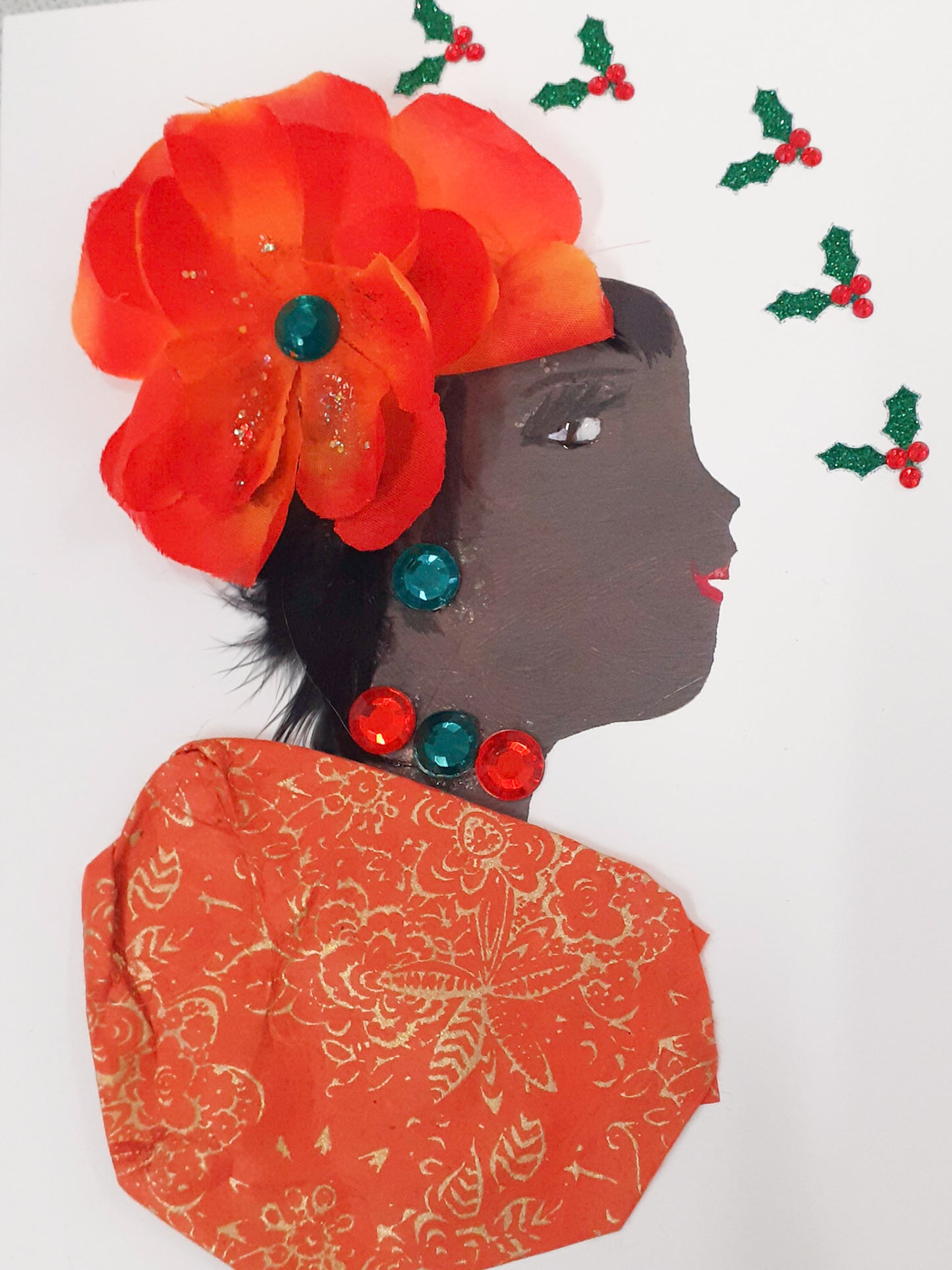 This card is called Orange Party. She wears a orange blouse with gold floral detail, and a large orange flower in her hair. Surrounding her, there is mistletoe. 