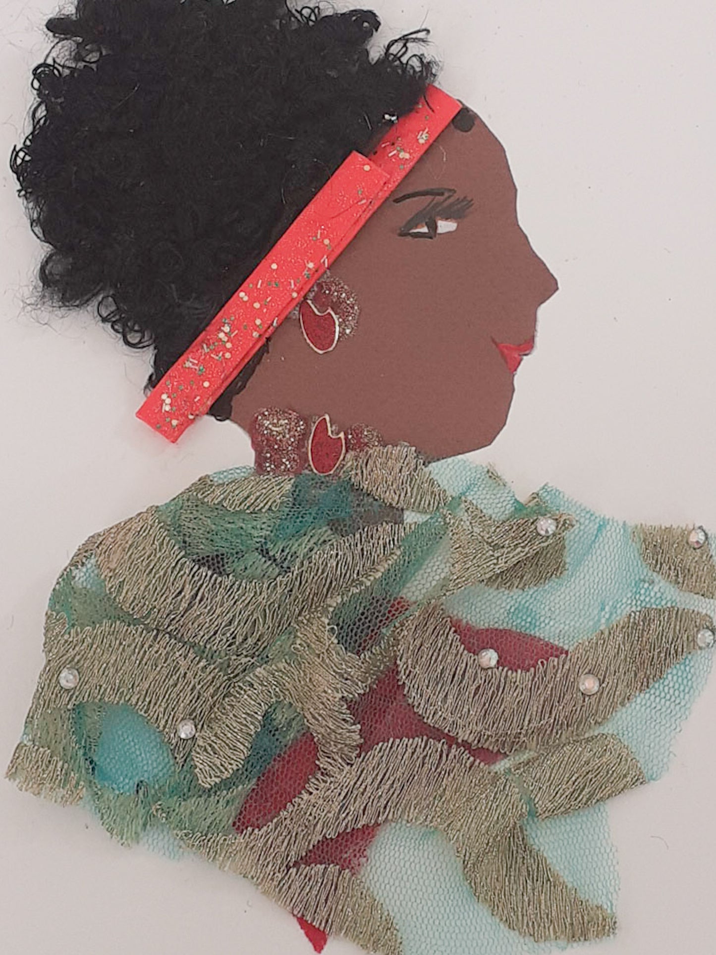 This card is of a woman named Tiffany. Tiffany wears a blue chiffon material blouse with embroidery on it. In her black curly hair, she wears a bright red headband. 