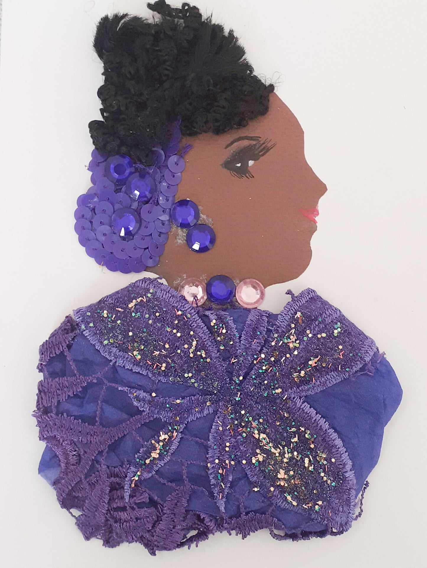 She wears a purple lace dress with a matching sequin scarf in her hair and purple earrings 