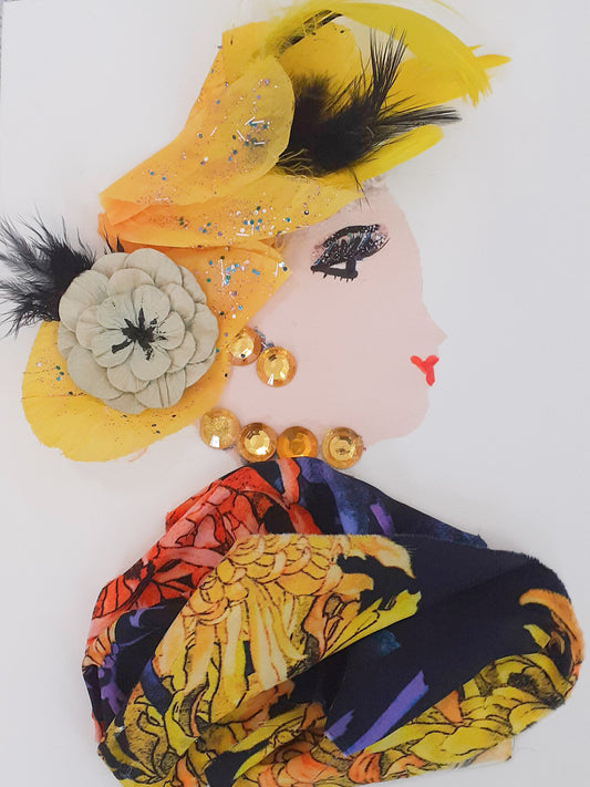 This card is given the name Chloe Belgium. She wears a flower patterned dress which has yellow and red petals and a dark navy blue background. In her hair, she wears yellow petals and black feathers, and a tan flower as well. Her necklace and earrings both have yellow gems.