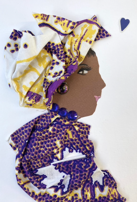 This card is called Kehlani. She wears a purple white and yellow printed matching headdress and blouse, and a small blue gem necklace. In the right corner, there is a small blue heart.