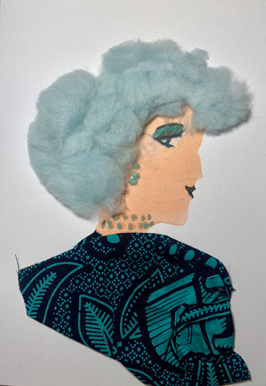 This card is of a woman given the name Freda. Freda wears a nature patterned blouse that is turquoise and black. Her jewellery is dainty and blue. He hair is blue and almost cotton like.
