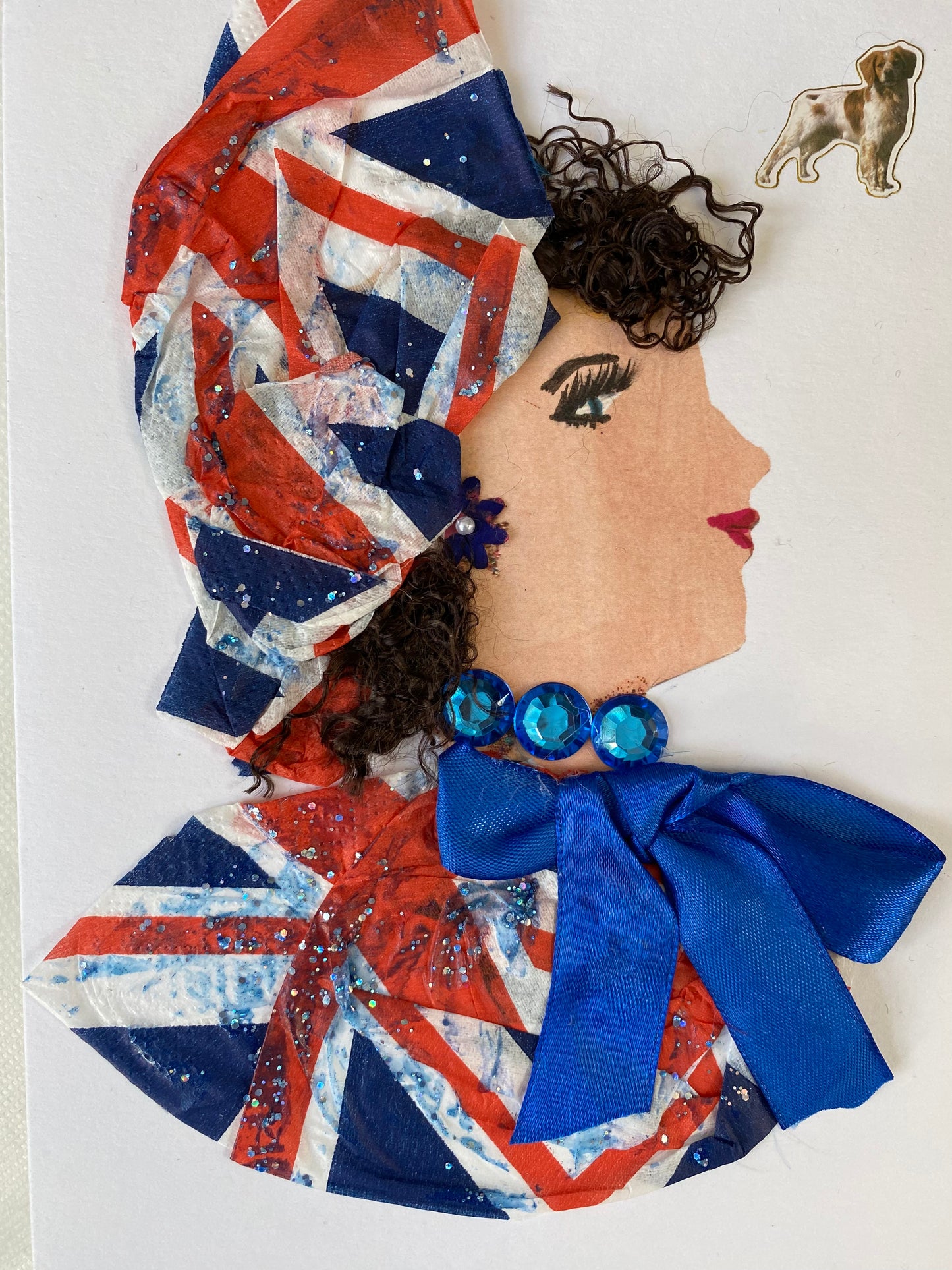 I designed this card of a woman named Dr. Buckingham Belinda. She has a white skin tone and is wearing a beautiful London flag print hat. She wears a matching London flag print blouse with a blue silk bow. She wears dazzling blue jewellery. In the corner there is a dog.