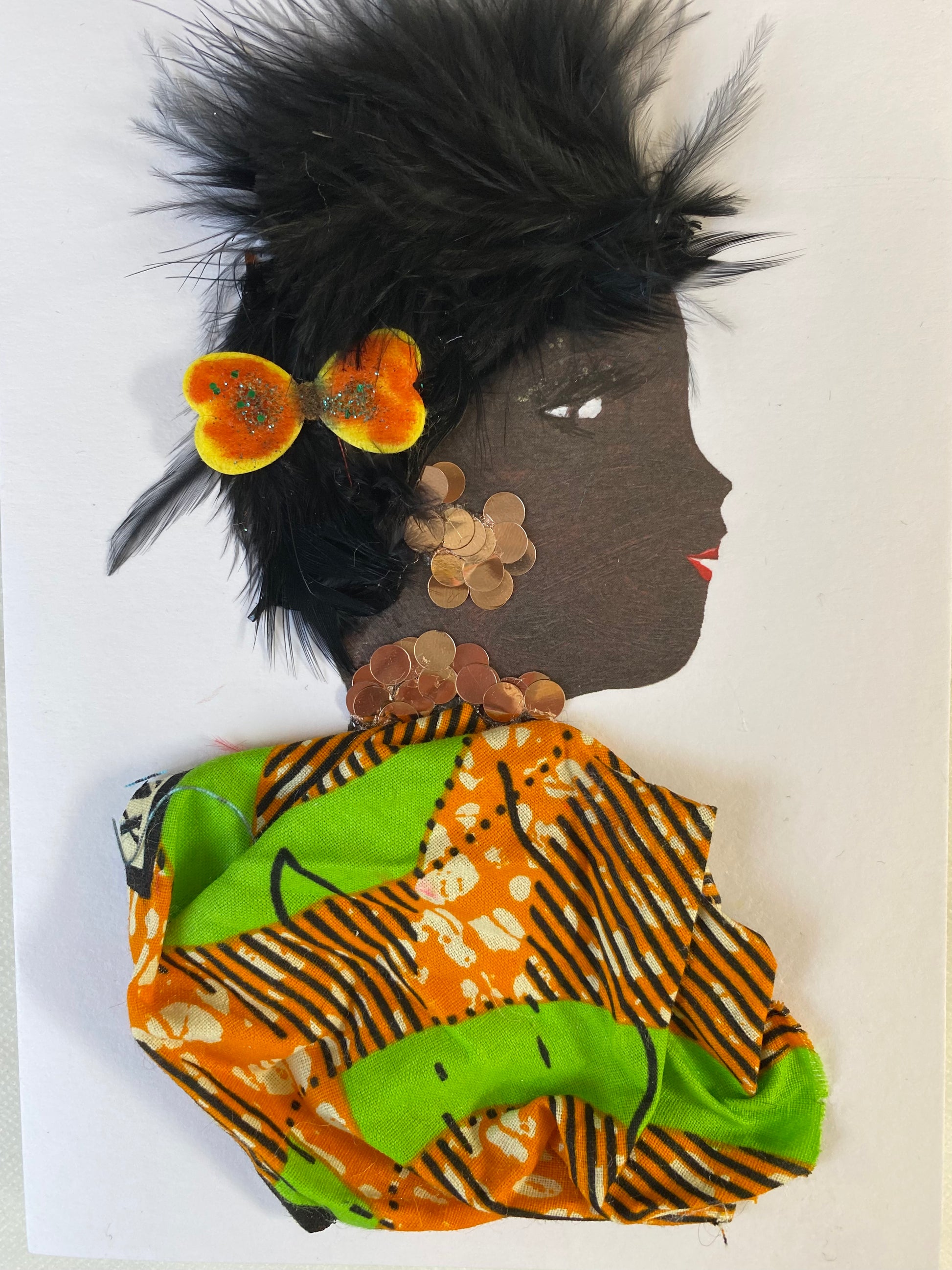 I designed this card of a woman named Groovy Galápogos. She has a black skin tone and is wearing a cute orange and yellow bow in her hair. She wears a pretty pattern orange and green blouse. She wears brown circular jewellery. 