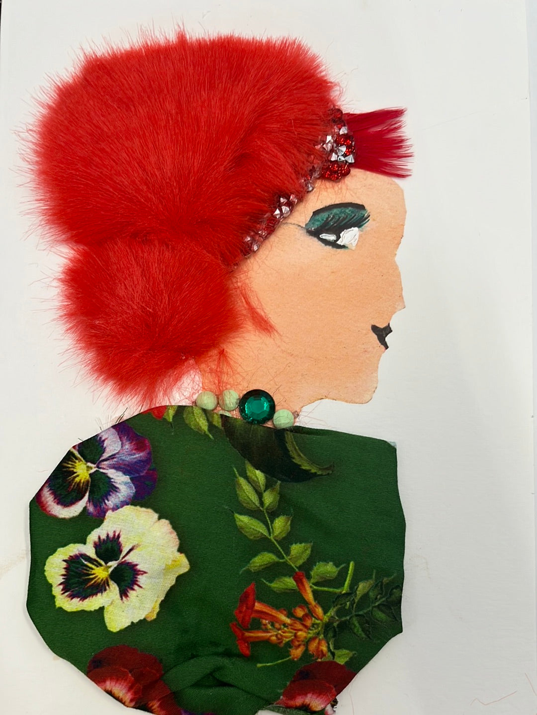 She wears a green floral dress which gives a festive look to her red furry hair. 