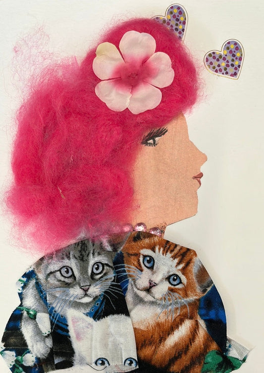 This card is called Kitty Kingdom. She wears a printed blouse which has many kittens on it. In her pink hair, she wears a light pink flower. On her right, there is two purple hearts.