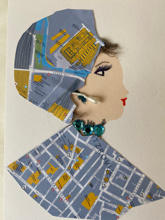 I designed this card of a woman named Dr. Constance Courageous. She has a white skin tone and is wearing is hat with a map print. She wears a matching blouse that also has a map print on it. She wears a stunning green gem necklace with white pearl earrings.