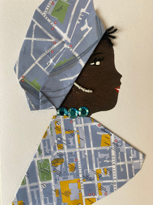 I designed this card of a woman named Juliette Jubilee. She is wearing a beautiful hat with a map print. She wears a matching map print blouse. She wears a pretty blue gem necklace and white dangling earrings.