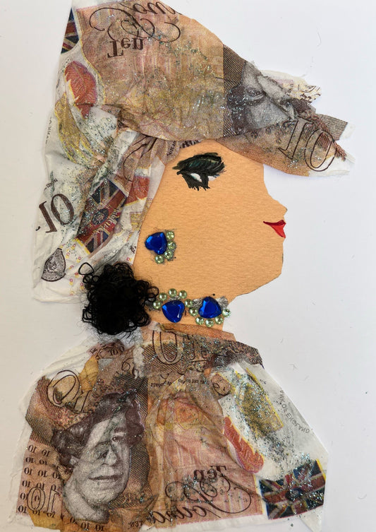 This card is called Amoni. She wears a money printed fabric as her blouse and headscarf. Her short blakc ponytail can be seen out of the bottom. She wears blue and green gem jewellery.