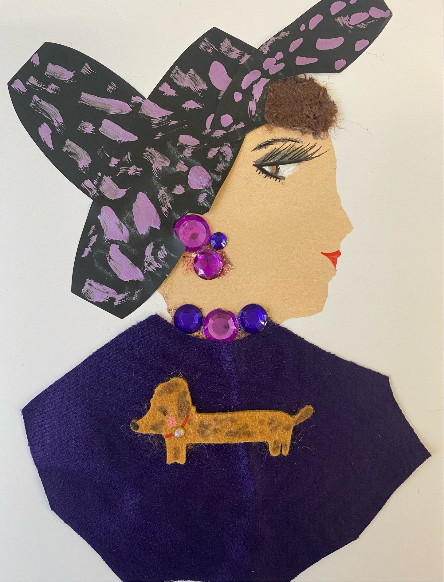 I designed this card called Heather Purple a unique collectible card featuring a woman sporting a stylish black and pink hat. Her signature purple blouse is highlighted with an eye-catching gold-plated dog emblem. Finishing the look, elegant purple and pink jewellery glimmers in the light. An ideal choice for the modern collector.