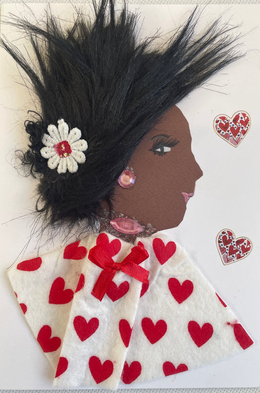This  picture has a black  woman I have called Elizabeth wearing  a blouse decorated with red hearts and a matching red bow. There is a single flower in her spiky hair. She has precious pink jewellery on as well. There are two red hearts on her right side.