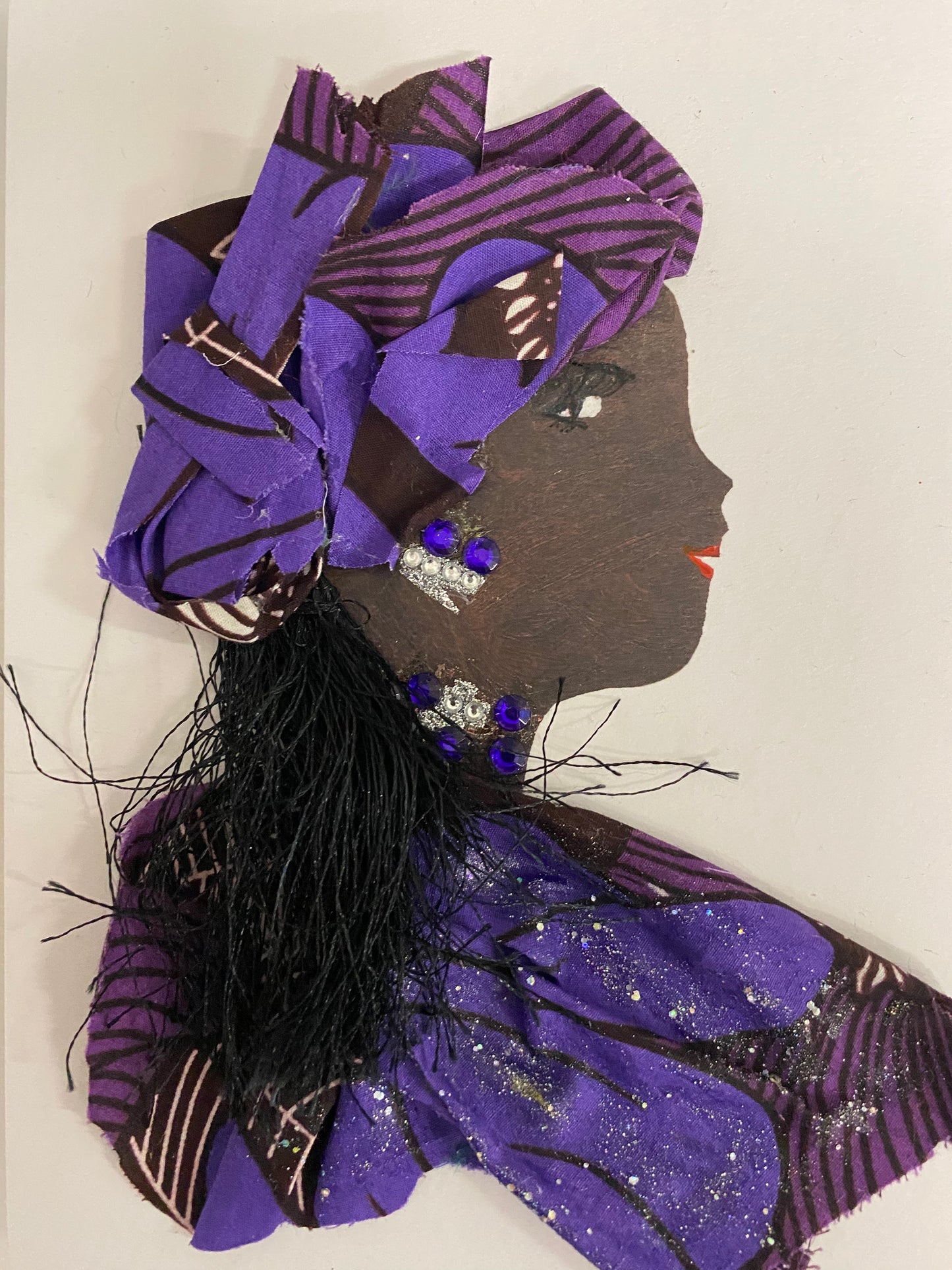 I designed this card of a woman who is wearing pattern hat filled with multiple shades of purple. She is wearing a pattern blouse that also has multiple shades of purple. She wears darling silver jewellery. 