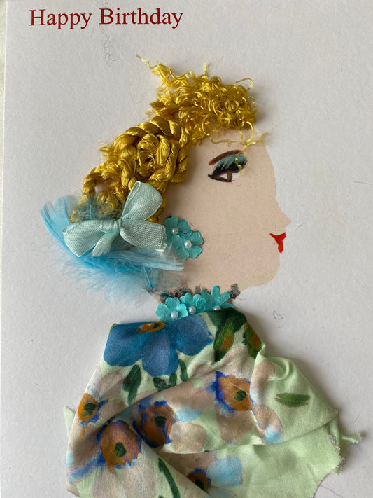 I designed this card of a woman named Bailey Berry Beautiful. She has a white skin tone and wears a baby blue bow in her hair. She wears an elegant floral blouse. She wears blue floral jewellery. Above her head it says "Happy Birthday."