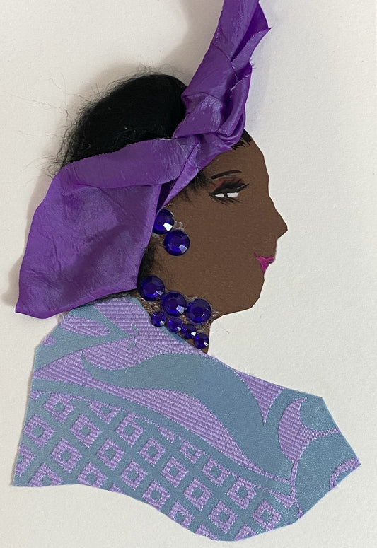 This card is called Peju. She wears a patterned blouse which is light blue and lavender, and a purple headscarf in her black hair.