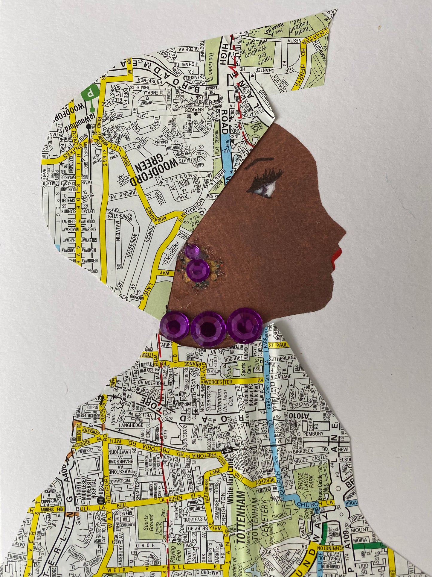 I designed this card of a woman who is wearings a beautiful map print head wrap. She wears a matching map print blouse. She wears dazzling purple gem jewellery.