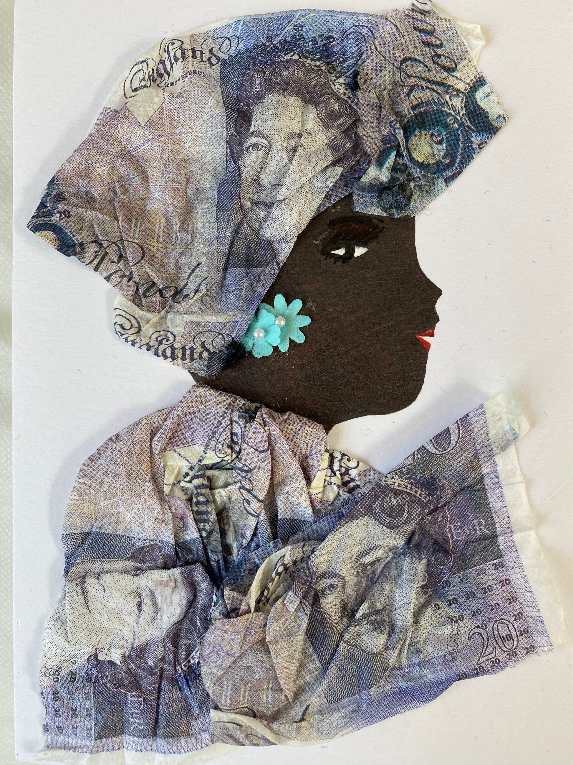 I designed this card of a woman who is wearing a charming purple money print headwrap. She wears a gorgeous purple money print blouse. She wears beautiful light blue flower earrings. 