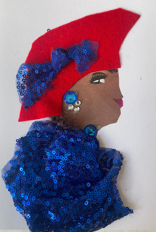 I designed this card of a woman named Everly Envious. She has a brown skin tone and is wearing a red hat with a blue sequence bow on the side. She is wearing a blue sequence blouse. She is wearing blue and silver jewellery.