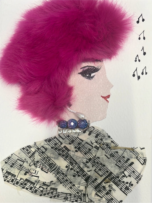 This card has been given the name Sofia. Sofia wears a music sheet printed fabric as her blouse, her hair is bright pink fur, and she has a gem necklace on. To her right, there are small music notes drawn on. 
