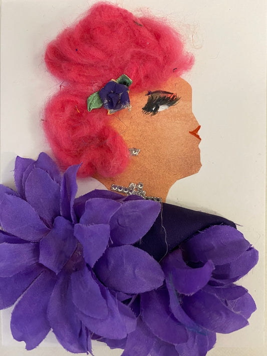 I designed this card of a woman who is wearing a stunning purple floral clip in her hair. She wears a gorgeous purple petal blouse. She wears shimmery silver jewellery. 