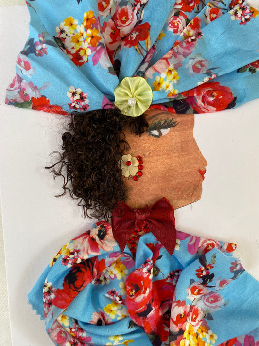 I designed this handmade card of a woman named Dr. Great Portland. She has a white skin tone and is wearing beautiful blue floral hatinator. She wears a matching blue floral blouse with a red bow in the center of it. She wears yellow and red jewellery.