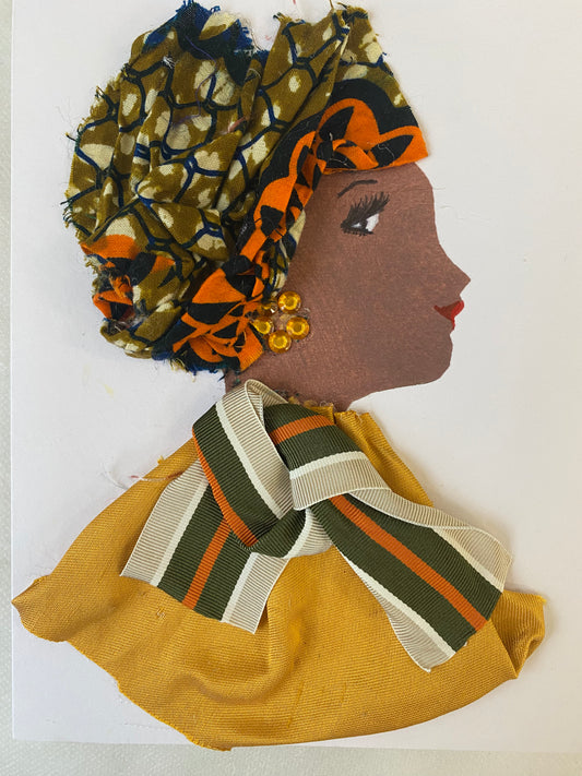 I designed this handmade card of a woman named Golden Gabriella. She has a brown skin tone wears an orange and green ankara hat. She wears an orange and green stripe bow with a graceful golden blouse. She wears beautiful gold earrings.
