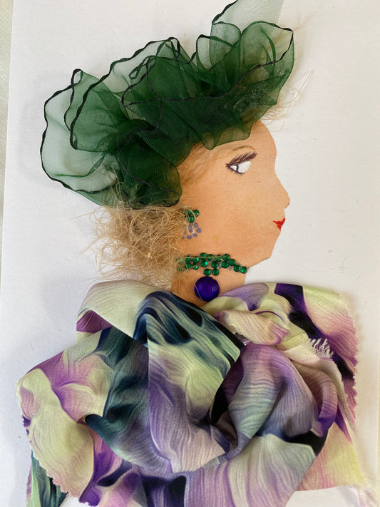 I designed this card of a woman named Doctor Warren Street. She has a white skin tone and is wearing a graceful green hatinator. She wears a delicate colorful blouse. She wears beautiful green and purple jewellery.