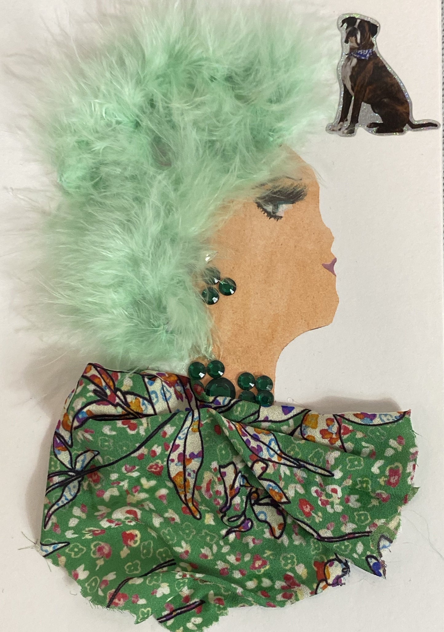 This card depicts a woman given the title Dog Walker. She wears a green floral blouse with small colourful patterns on it, a green gem necklace, and has furry mint green hair. In the top right corner there is a sticker of a dog. 