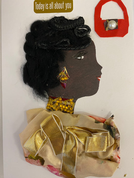 I designed this card of a woman named Beth Buttermilk. She has a black skin tone and wears a yellow floral blouse with a gold bow in the center. She wears gold shiny jewellery. Above her head it says "today is all about you" and there is a red purse. 