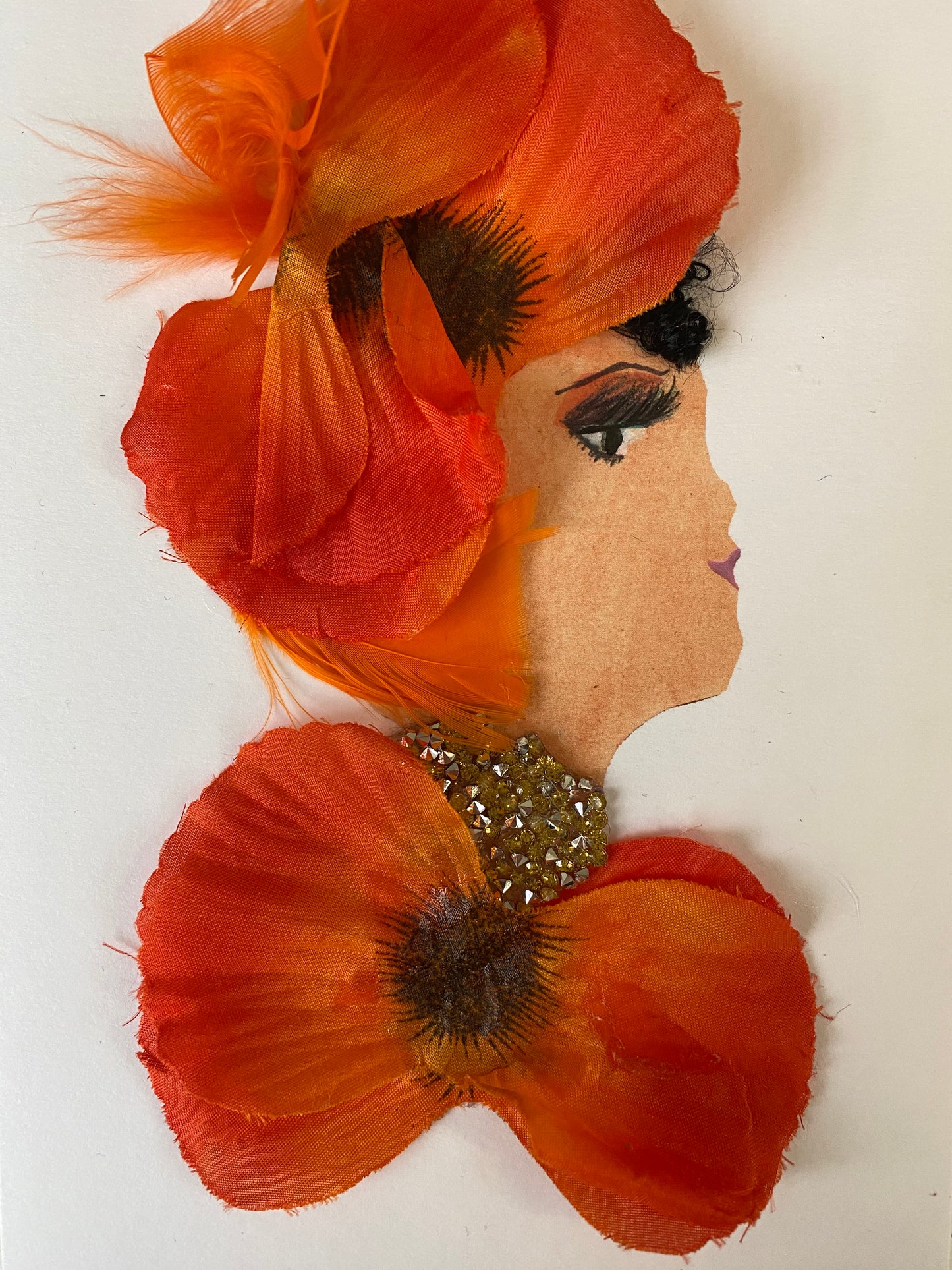 I designed this card of a woman named Hannah Honey. She has a white skin tone and wears a bright and dark orange hatinator with orange feathers. She wears a matching bright and dark orange blouse. She wears stunning silver jewellery.